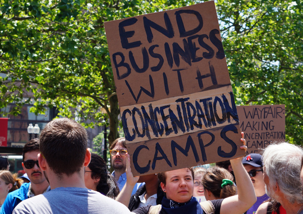 Wayfair protester with concentration-camp sign