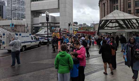 Waiting for a shuttle bus outside South Station