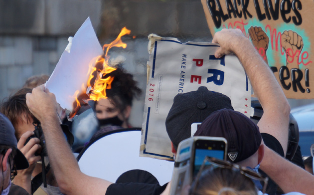 Flaming Trump signs