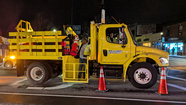 Workers removing cones at the intersection