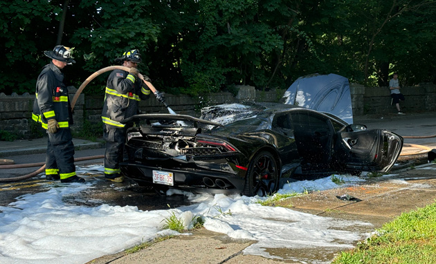 Firefighters keep pouring foam on sports car